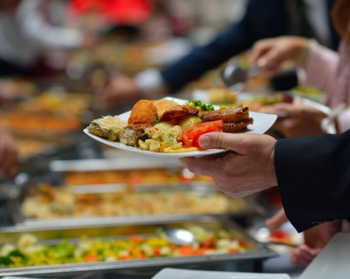 Diner putting food on plate